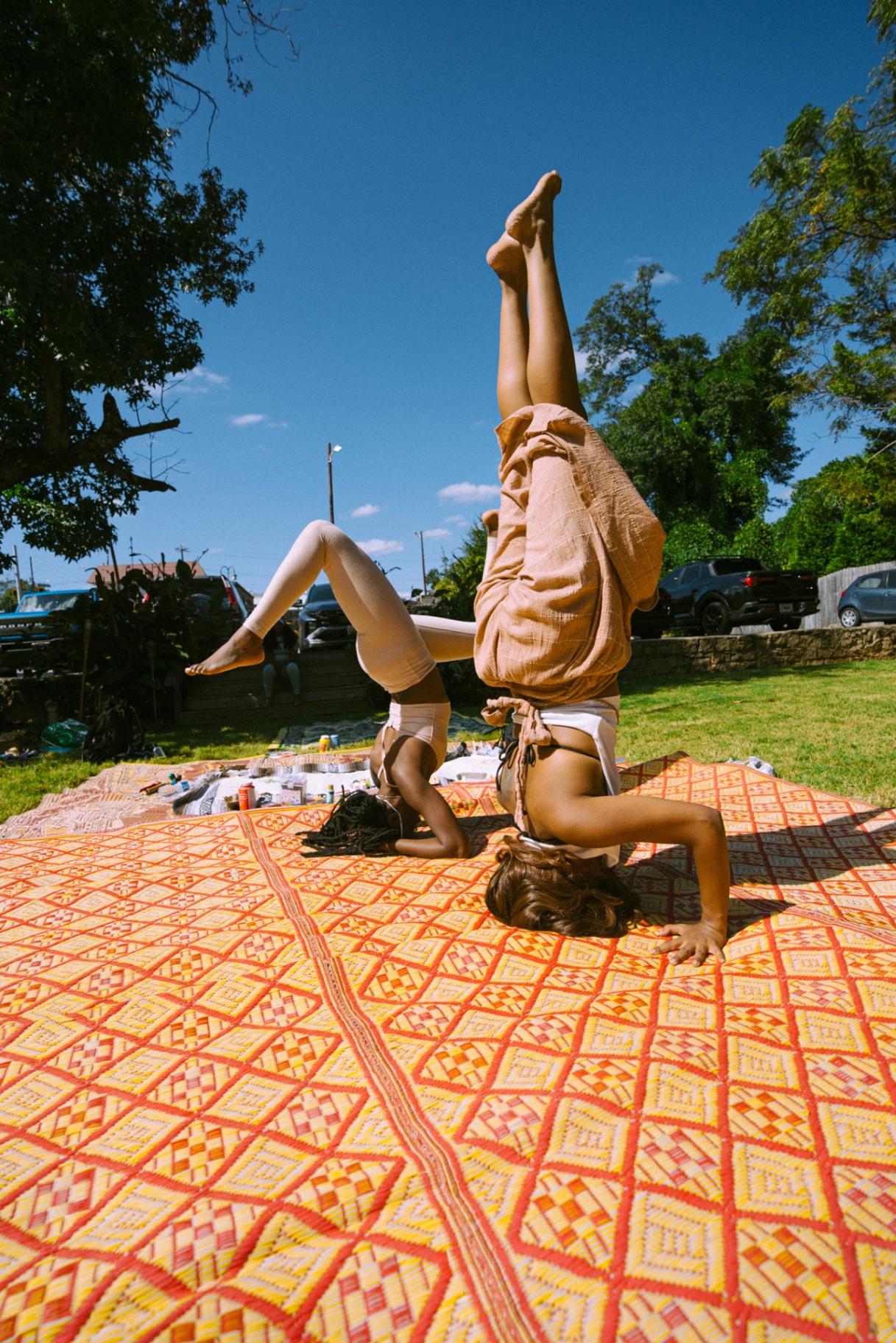 Partnered headstand practice during the Kemetic Sound Experience at Tassili's Raw Reality