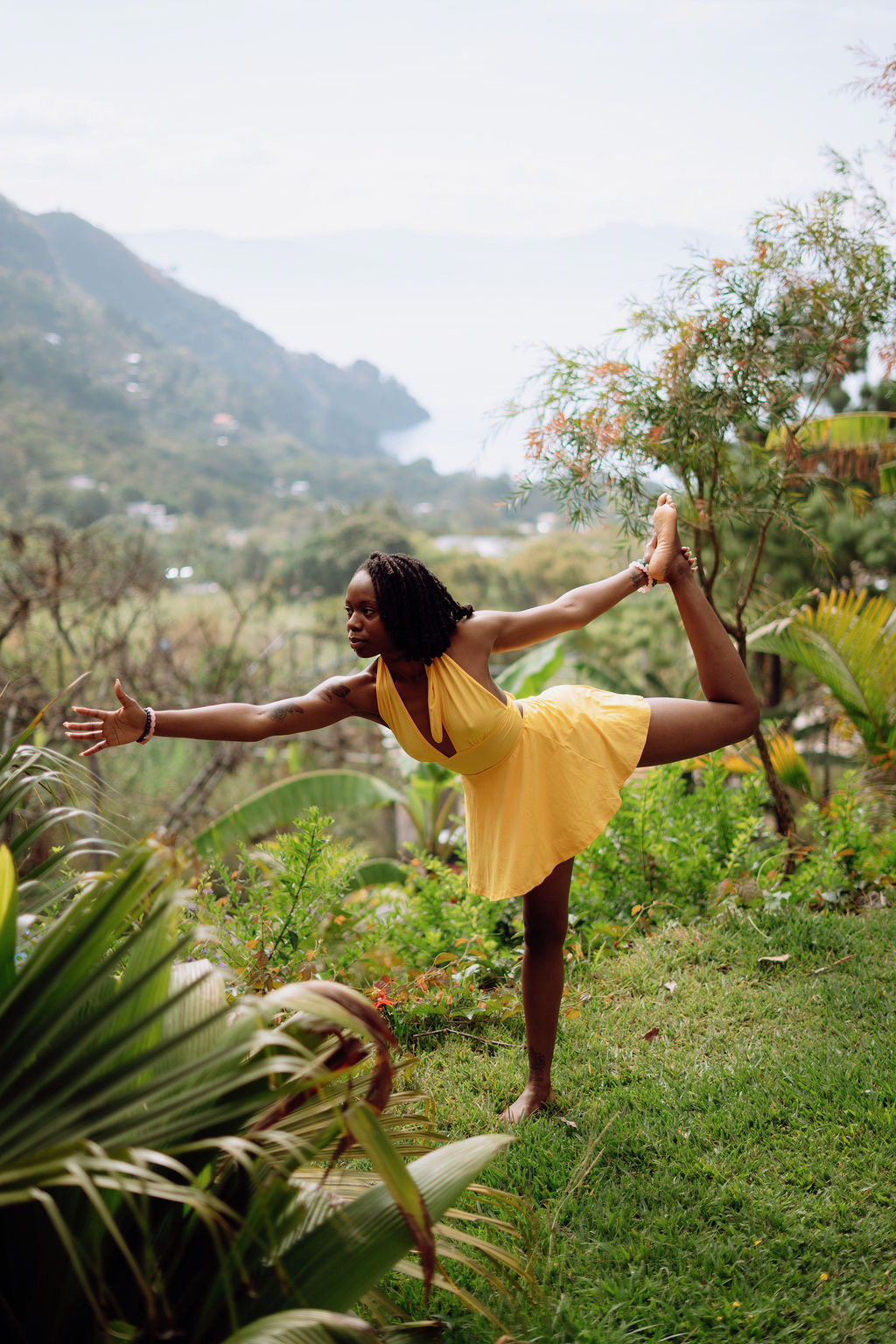 Empress in dancer's pose overlooking Lake Atitlán, Guatemala