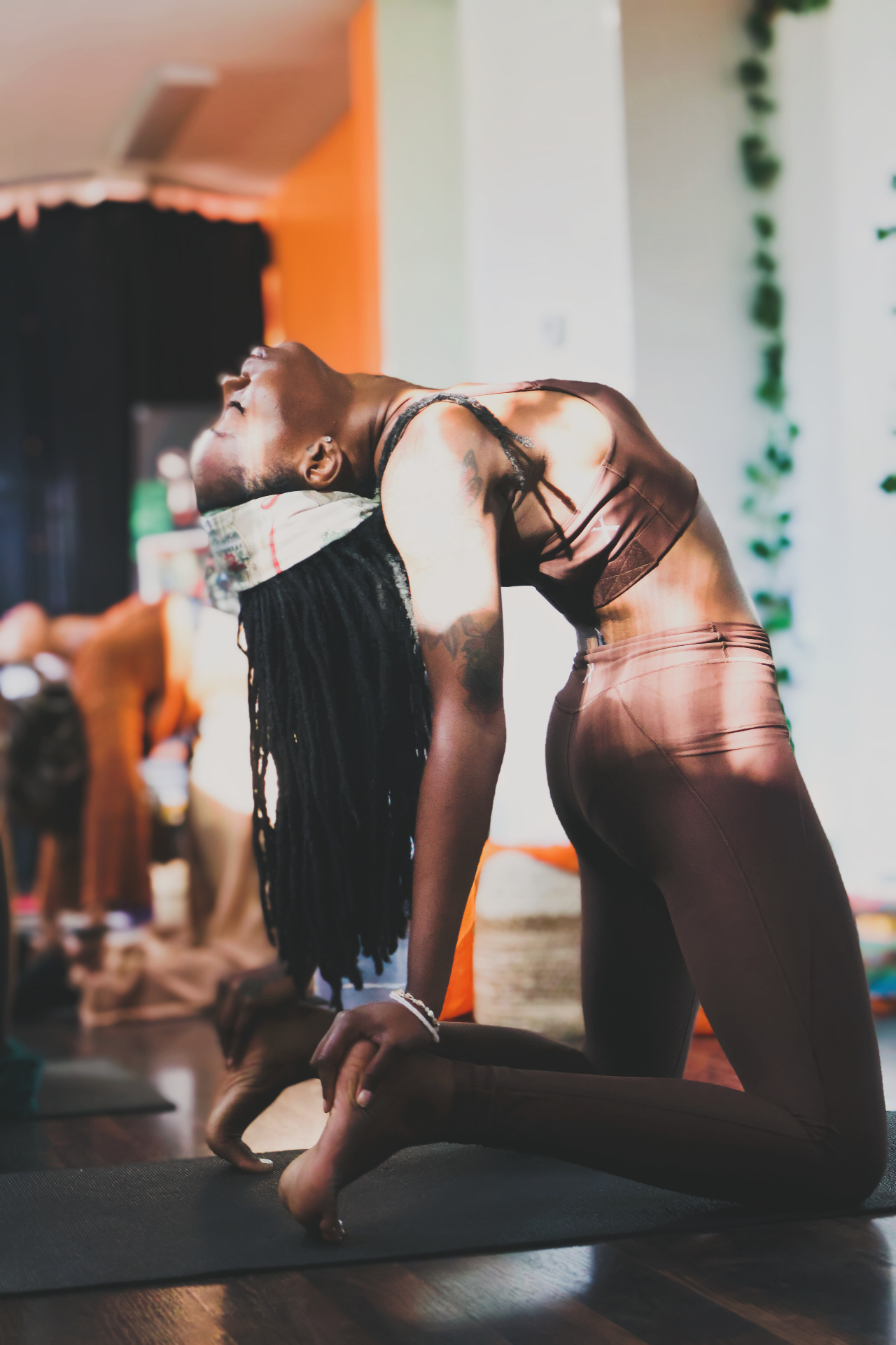 Guided camel pose during the Kemetic Sound Experience